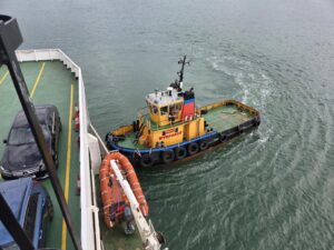 Red Funnel and tug