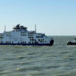 Wightlink ferry with tug