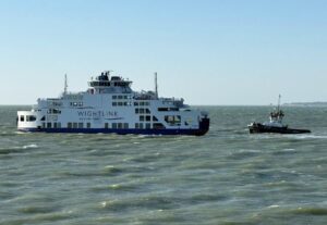 Wightlink ferry with tug