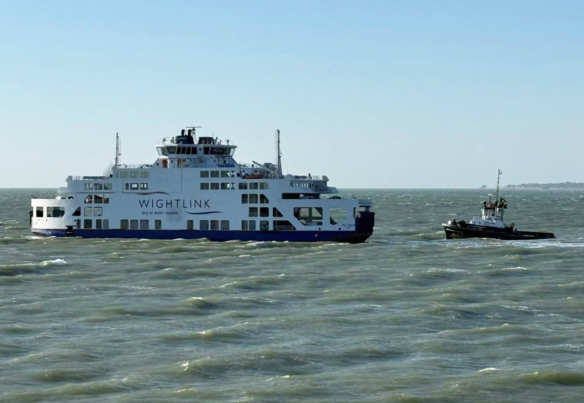 Wightlink ferry with tug