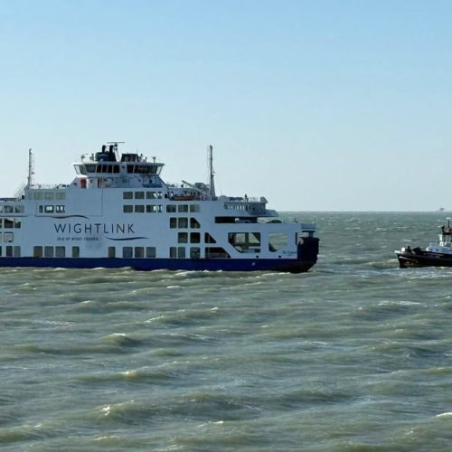 Wightlink ferry with tug